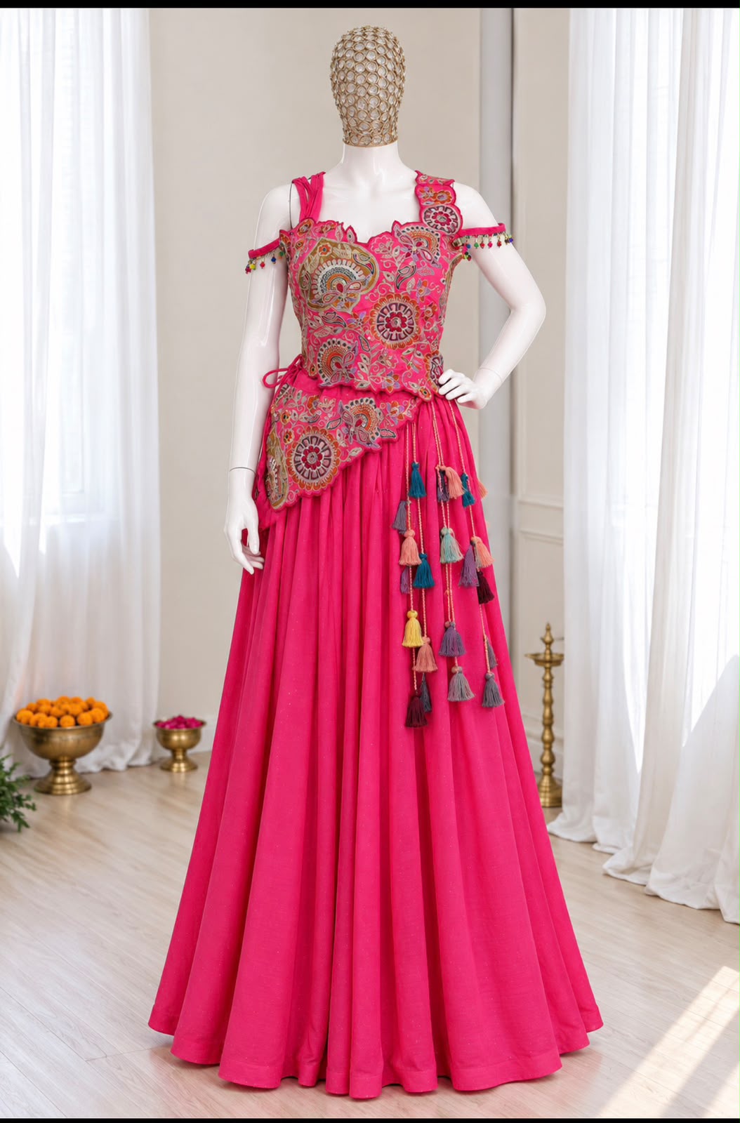 Stitched pink lehenga choli styled on a model with a flared skirt and embroidered blouse