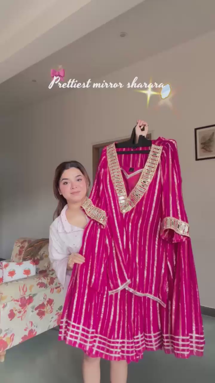 Pink Indian sharara set with gold zari stripes and embellished neckline