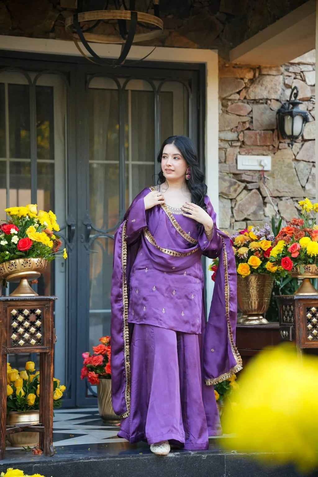 Purple embroidered kurta with palazzo pants and decorative dupatta styled for an elegant party look