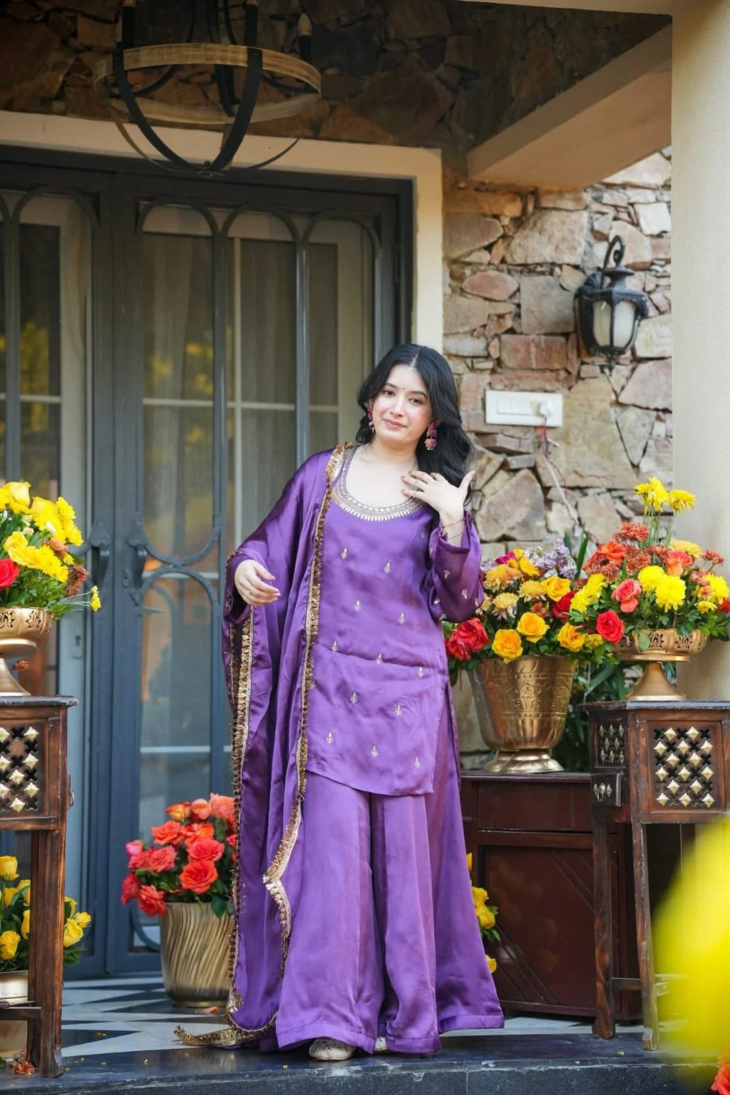 Close-up of purple embroidered kurta with detailed neckline, sequin work and lace-trimmed dupatta