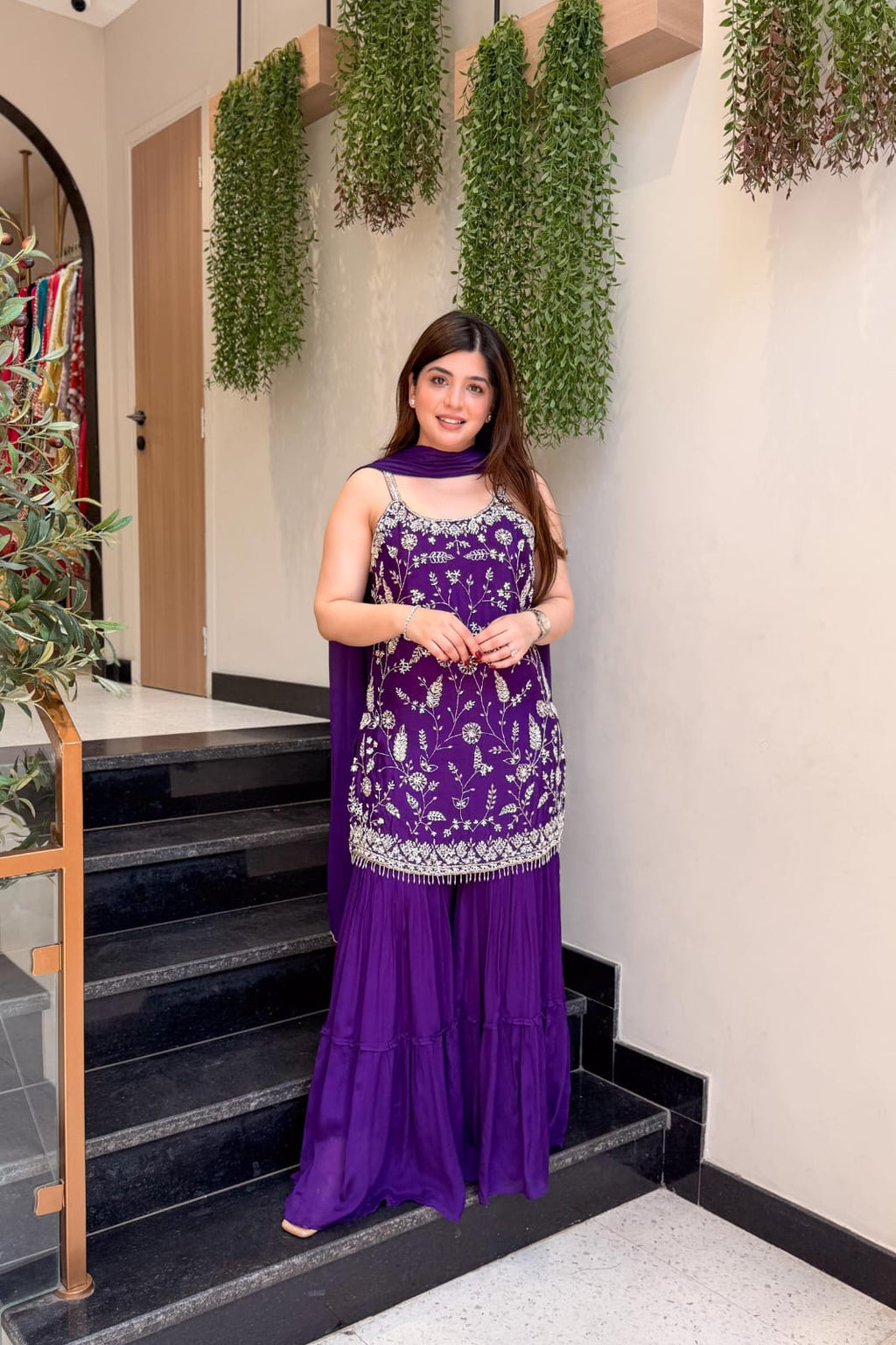 Full-length purple ethnic palazzo outfit with embroidered top and coordinating dupatta