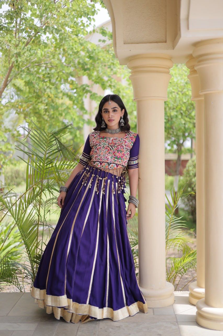 Close-up of Gamthi embroidery and mirror work on purple Navratri lehenga choli