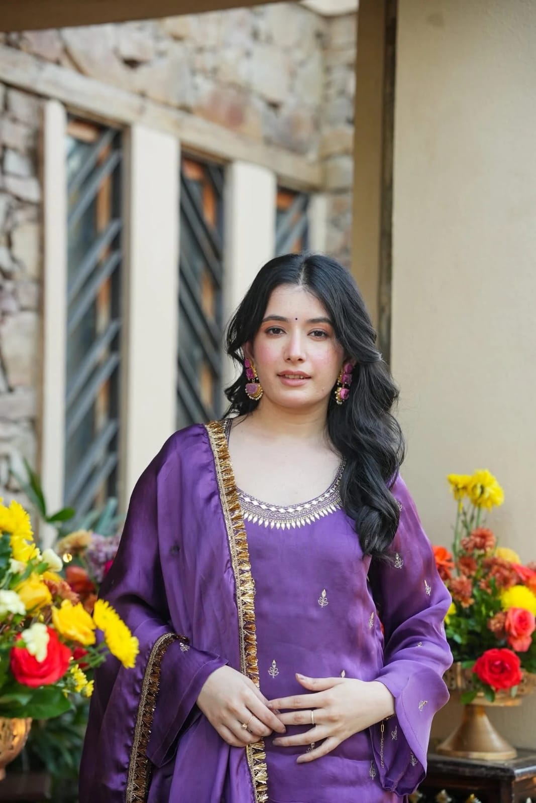 Purple kurta palazzo set with embroidered motifs and ornate dupatta styled for festive celebrations