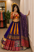 Twirl view of purple and orange chaniya choli showing four meter lehenga flare and printed borders