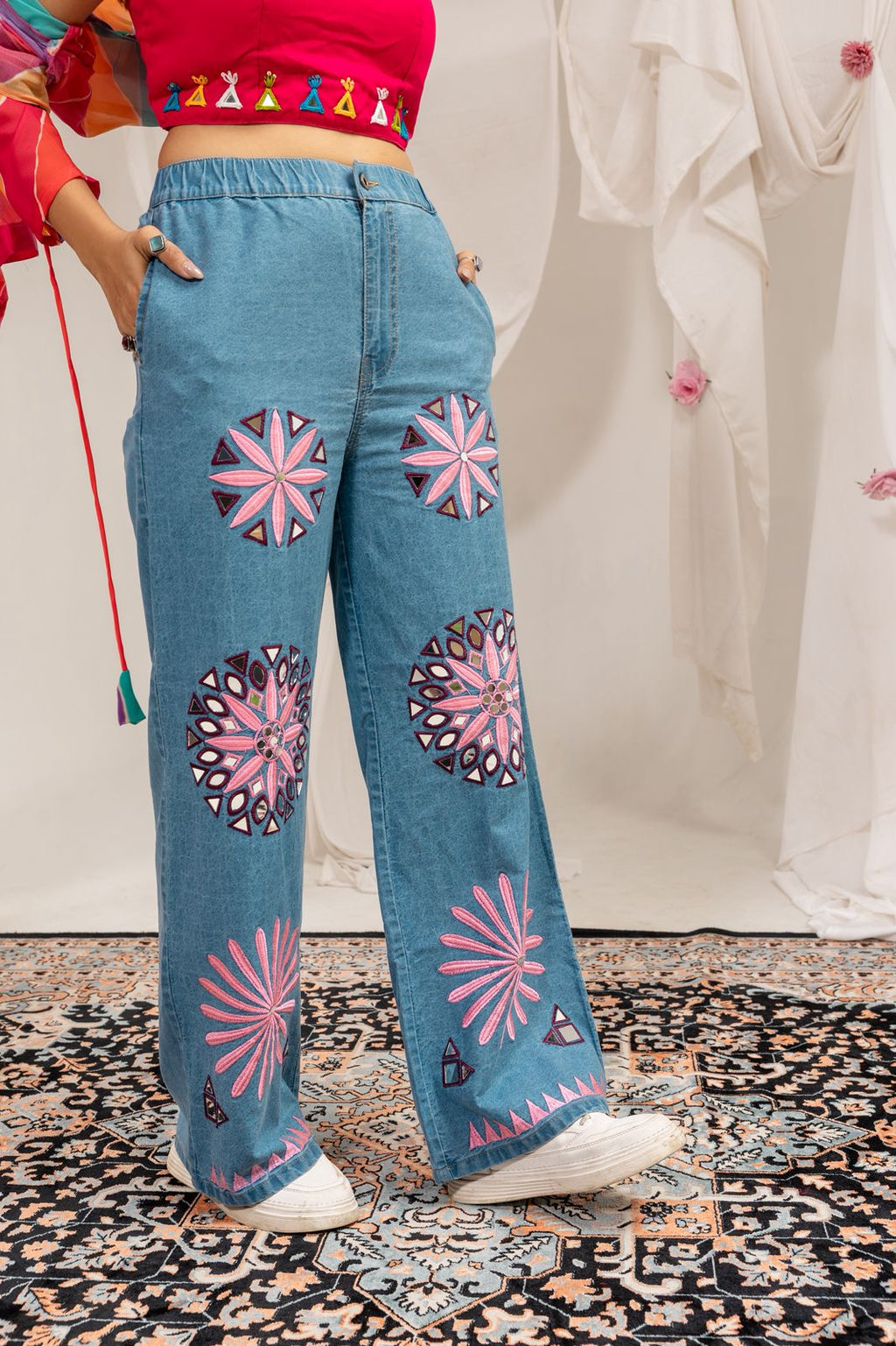 Woman styling Rang Denim Navratri outfit with embroidered jeans and colorful