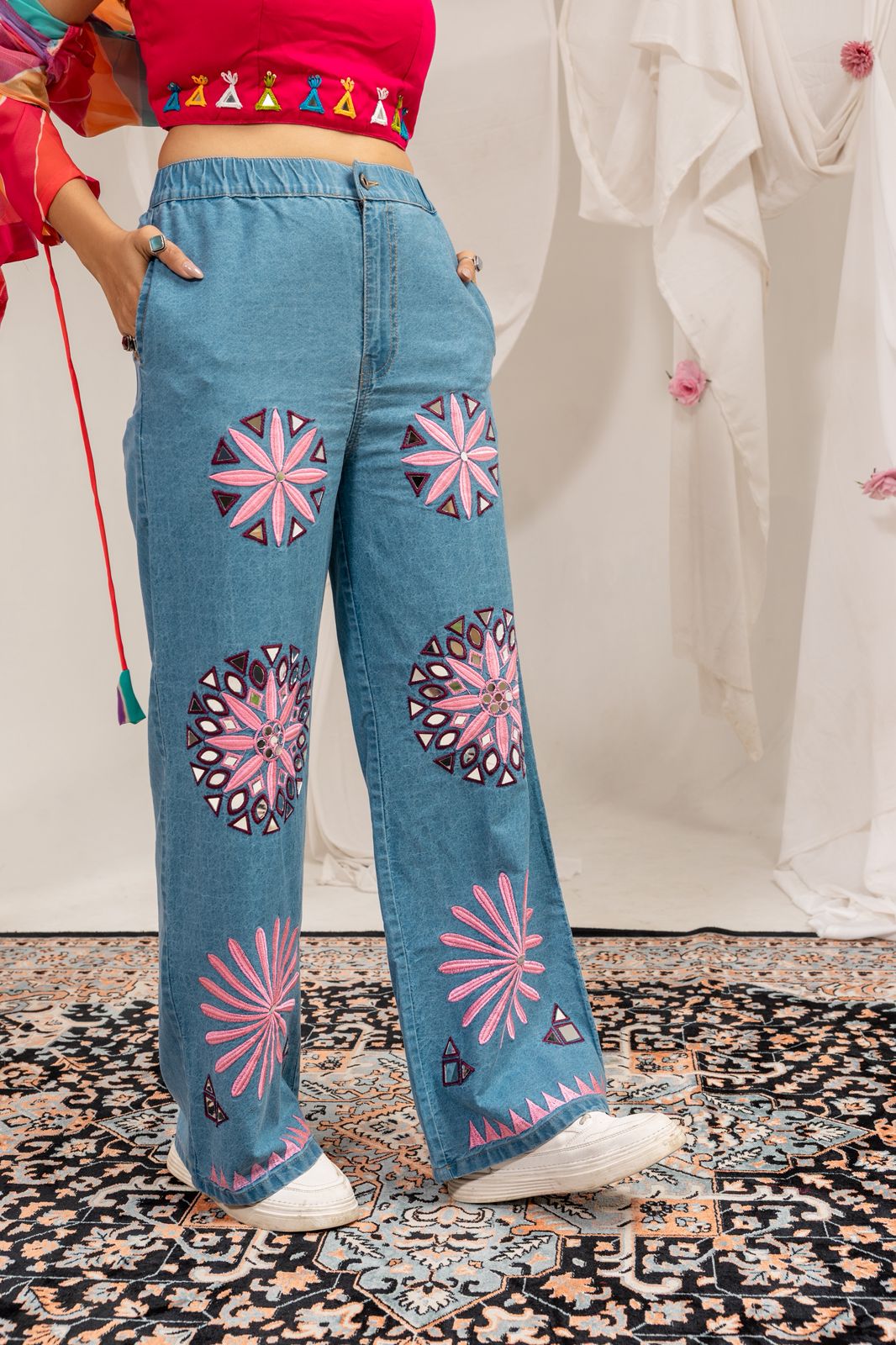 Woman styling Rang Denim Navratri outfit with embroidered jeans and colorful
