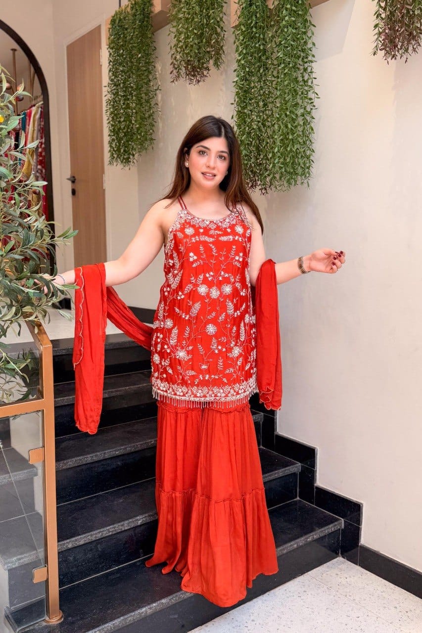 Full-length red embroidered Indian suit set with flowing palazzo pants