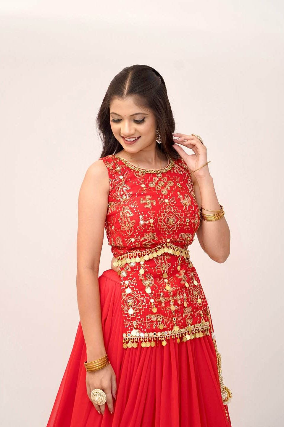Close view of red embroidered choli with thread, sequin and Sikka lace detailing