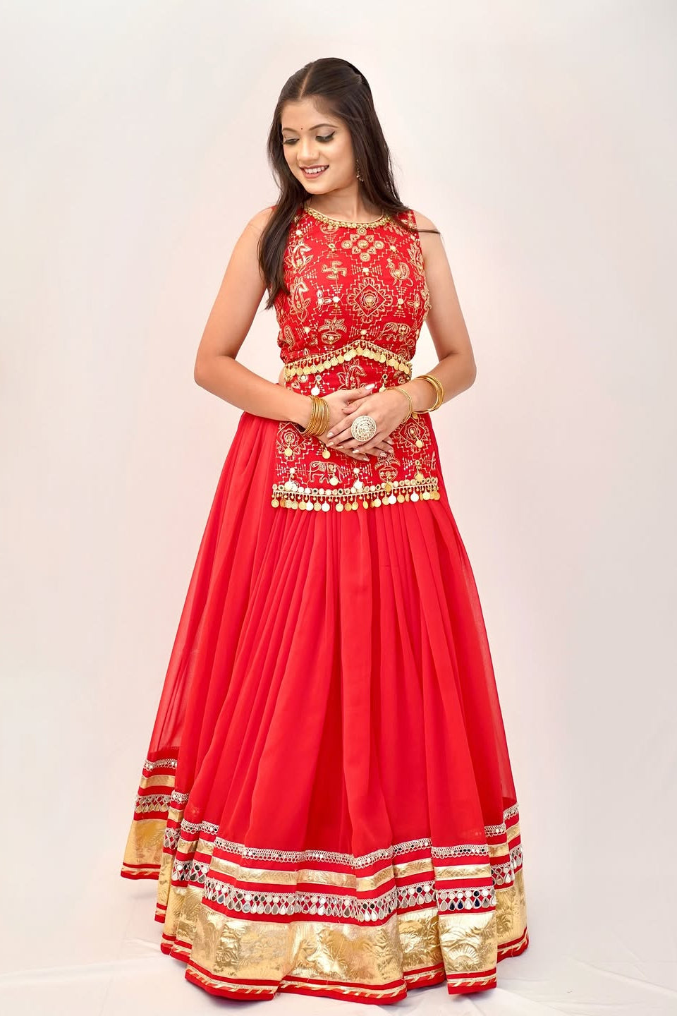Red lehenga choli front styling with embroidered choli, waist detailing and ornate border