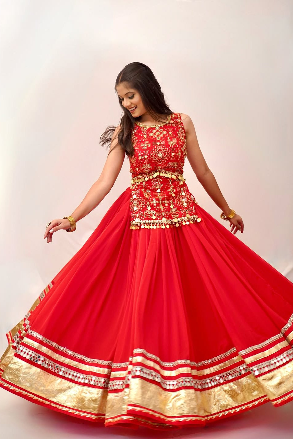 Red lehenga choli twirl highlighting the full 6-meter flair and embellished hem