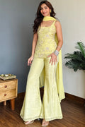 Yellow georgette suit featuring detailed embroidery and sequence work